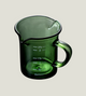Green measuring cup with handle on a white background