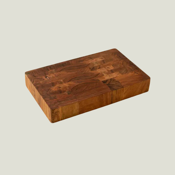 Wooden cutting board on a light gray background