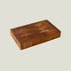 Wooden cutting board on a light gray background