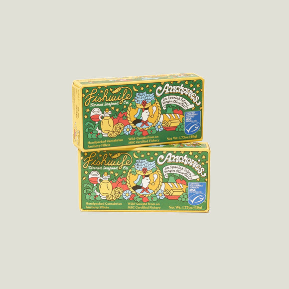 Two boxes of Anchovies and Fishwulf on a beige background