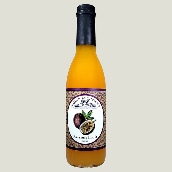 Bottle of Liquid Alchemist Passion Fruit Syrup on a white background