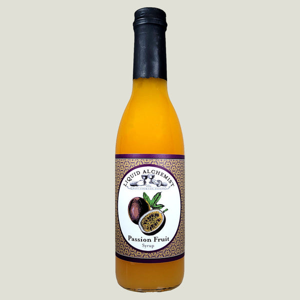 Bottle of Liquid Alchemist Passion Fruit Syrup on a white background