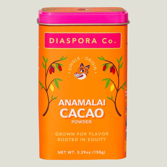 Orange canister of Anamalai Cacao Powder by Diaspora Co. on a white background