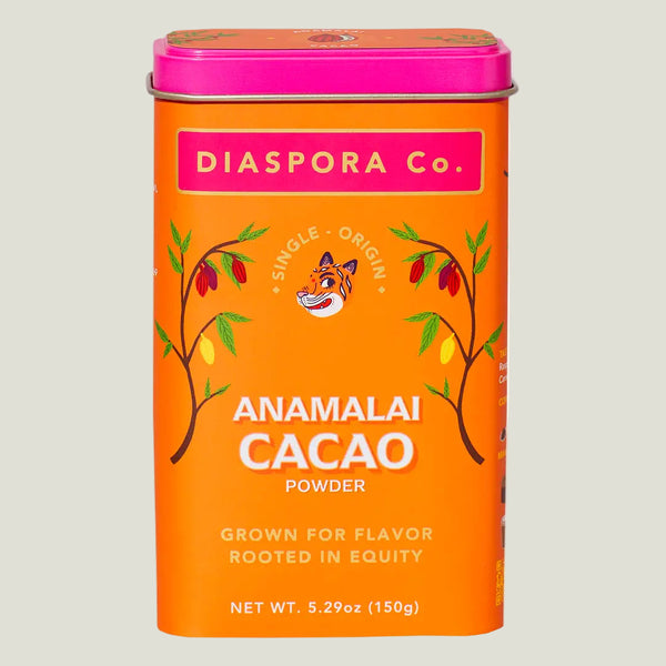 Orange canister of Anamalai Cacao Powder by Diaspora Co. on a white background