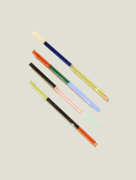 Set of colorful pens on a light gray background