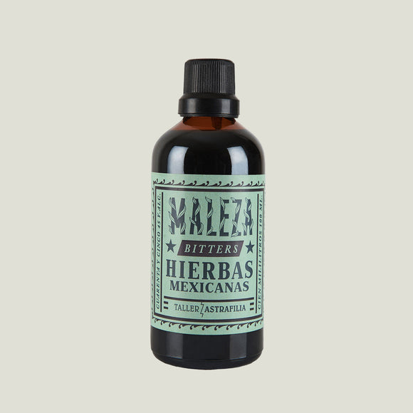 Bottle of Maleza Bitters Hierbas Mexicanas on a white background
