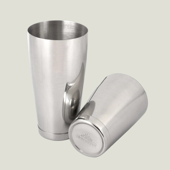 Two stainless steel tumblers on a white background