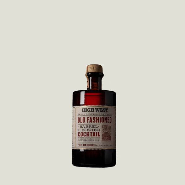 Bottle of High West Old Fashioned Barrel Finished Cocktail on a wooden surface with a brown background