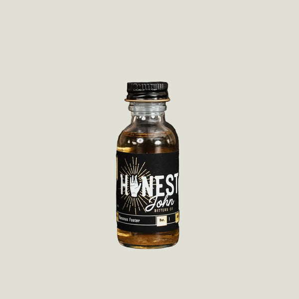 Bottle of 'Honest John' bitters on a black background