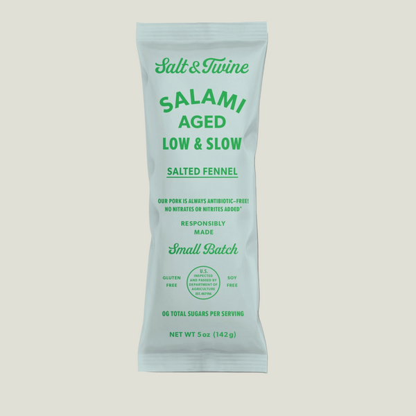 Light green package with Salt & Twine Salted Fennel Salami Low & Slow written in bright green.