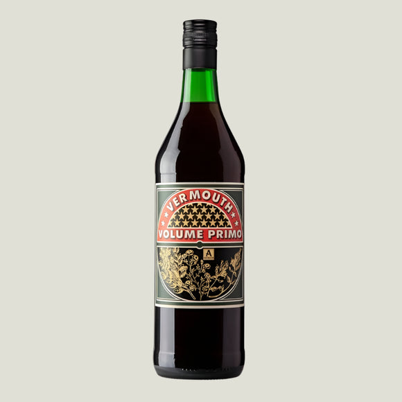 A bottle of Volume Primo Vermouth with label and green cap.