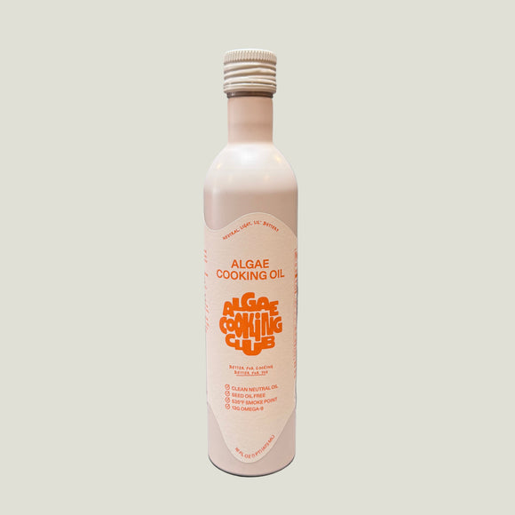 A bottle of algae cooking oil on a white background.