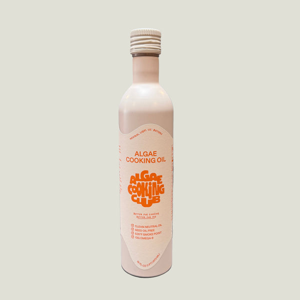 A bottle of algae cooking oil on a white background.