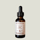 Bottle of Fraser Fir and Redwood scented Mustache & Beard Oil with a white background.