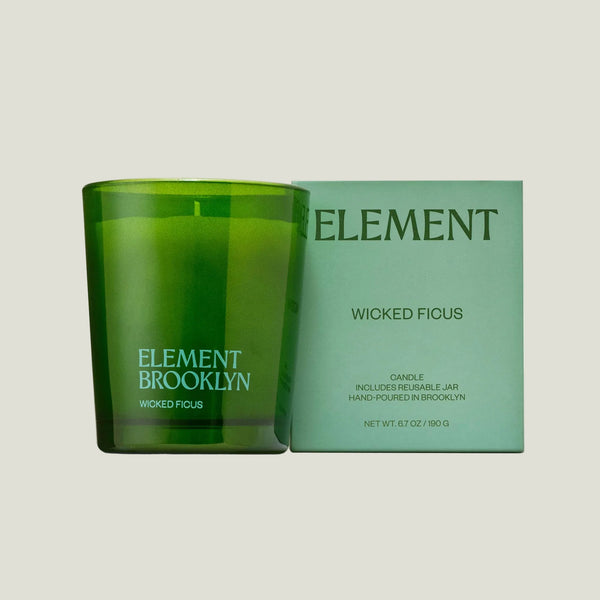 Green candle and packaging with 'Element Brooklyn' branding on a white background