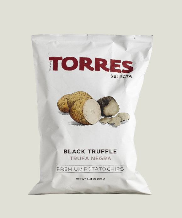 Bag of Torres Selecta Black Truffle potato chips on a marble surface