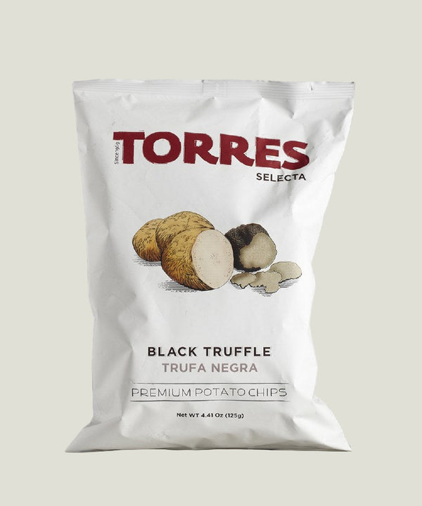 Bag of Torres Selecta Black Truffle potato chips on a marble surface