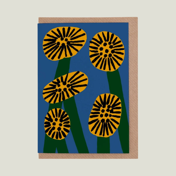 Greeting card with yellow and black floral design on a blue background