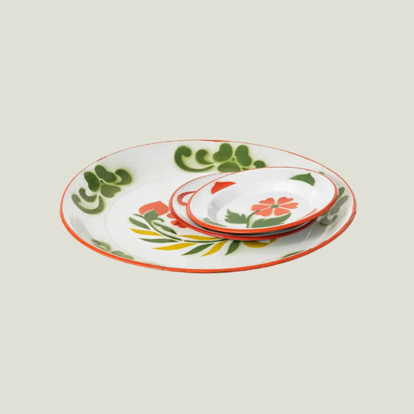 Set of ceramic plates with floral design on a white background