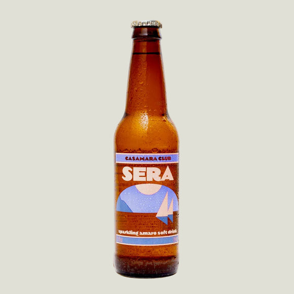 Brown bottle of Sera drink with a label on a beige background
