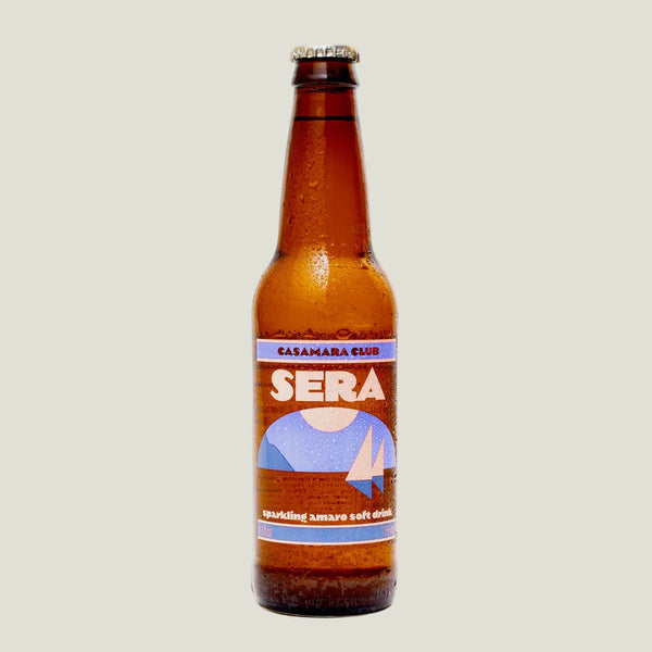Brown bottle of Sera drink with a label on a beige background