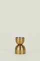 Gold-colored vase on a beige background