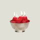 Small silver bowl with realistic strawberry candles that are lit, on an off-white background.
