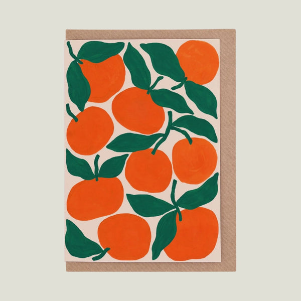 Card with many tangerine fruit with green leaves 