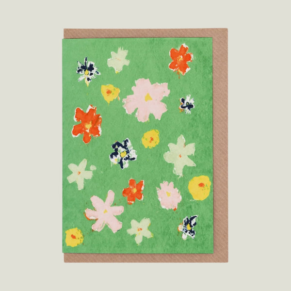 Greeting card with floral design on a green background
